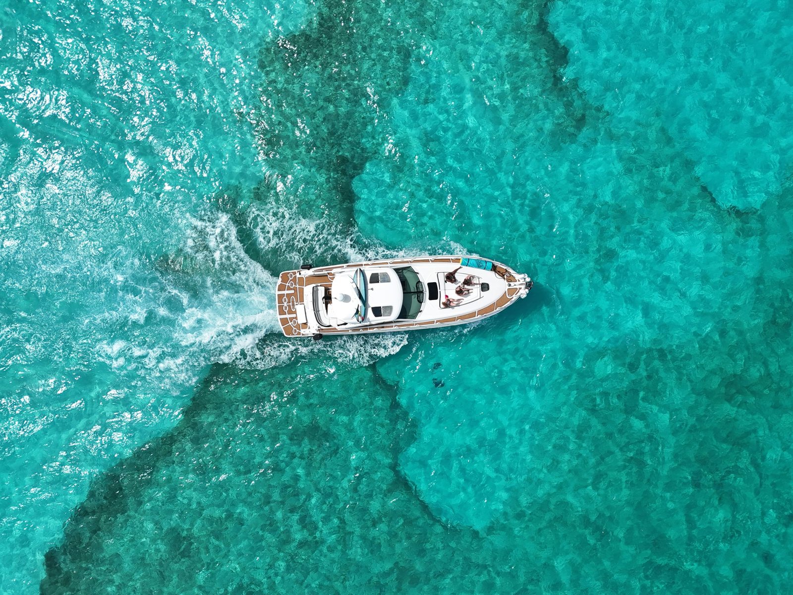 Yacht cruising over turquoise water